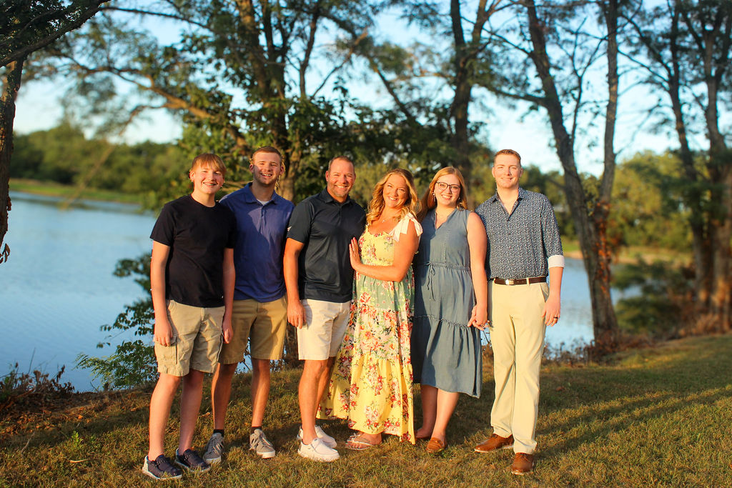 Jen Conrad with her family by the lake